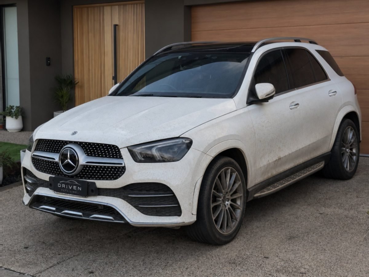 The same Mercedes-Benz GLE before detailing, covered in dirt and road spray